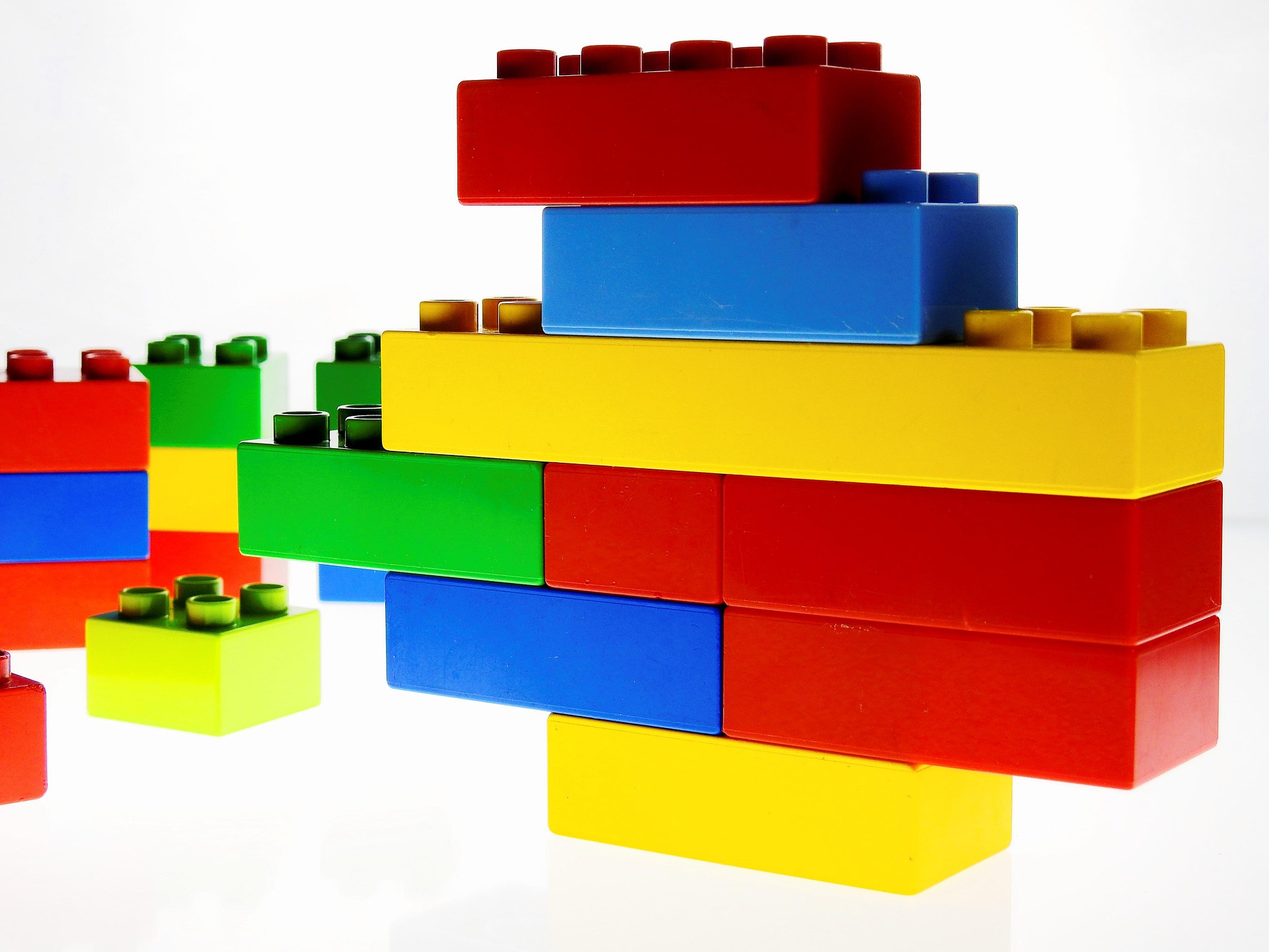 Colorful plastic bricks are stacked, interlocking