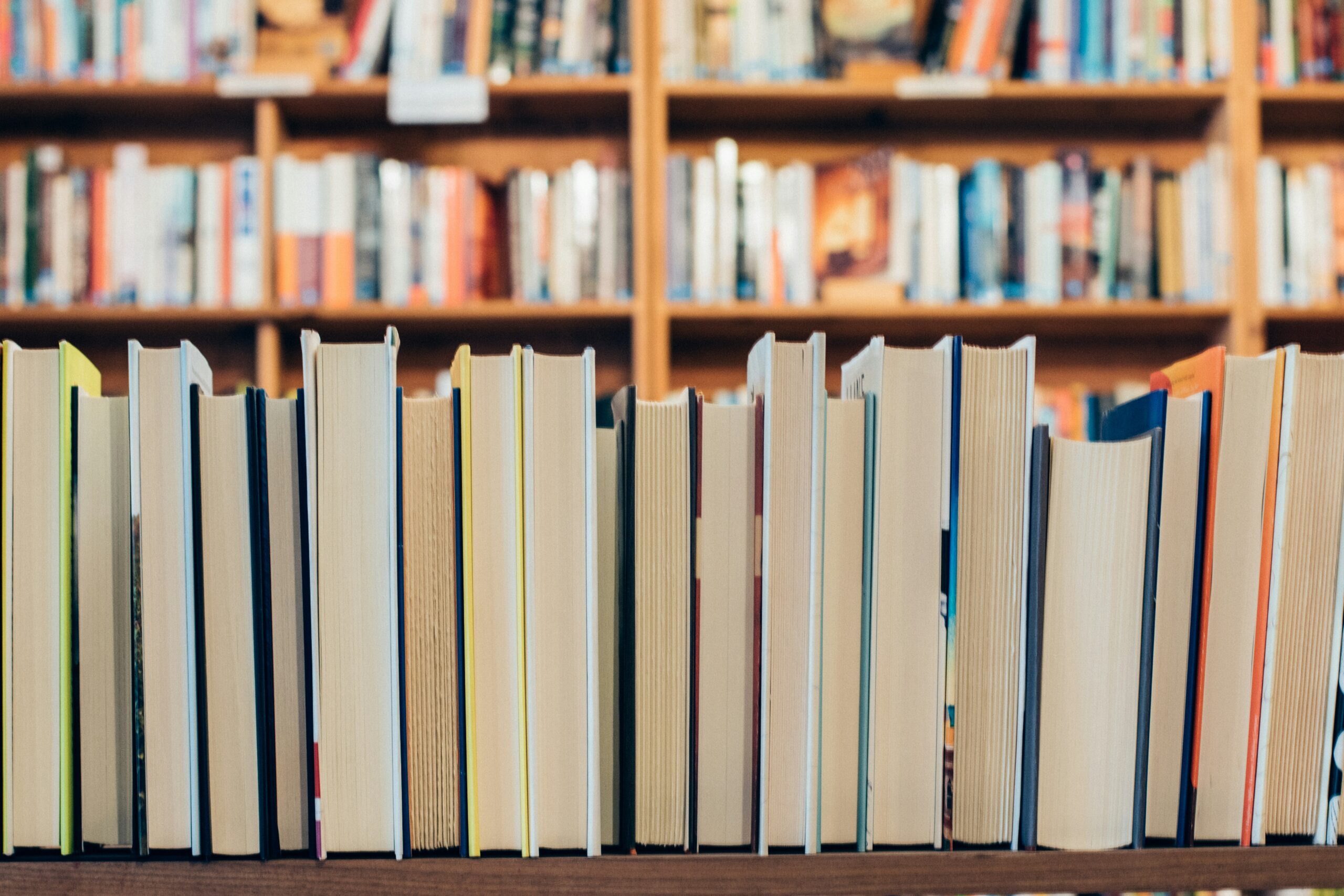 A photo of books on a shelf in a library